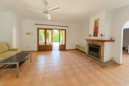 Living room with fireplace and patio door