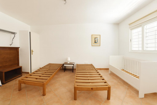 Empty bedroom with two single beds