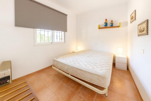 Simple bedroom with double bed