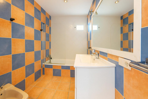 Bathroom with bathtub and sink