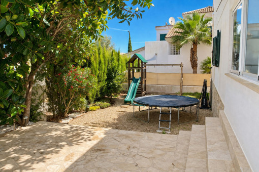 Garden and terrace to the left of the house