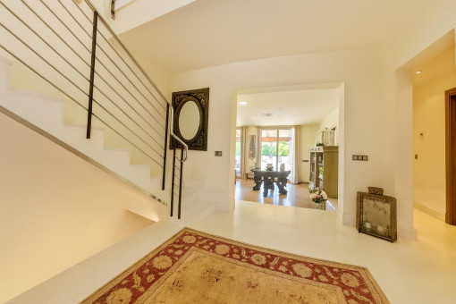 Modern bright entrance hall with staircase