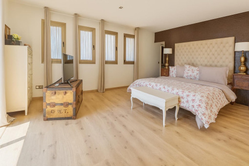 Bright master bedroom with dressing room