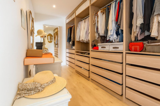 Spacious walk-in closet with clothing storage