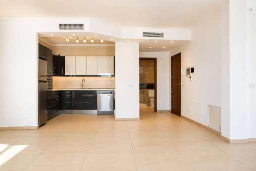 Open-plan living and dining room with adjoining kitchen