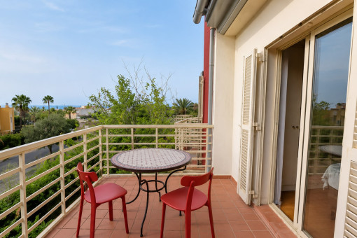 Balcony with table and sea view
