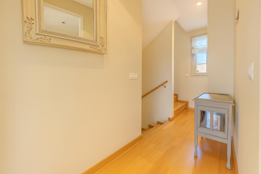 Bright landing area with wood flooring