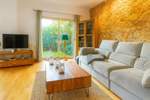 Cozy living room with stone wall