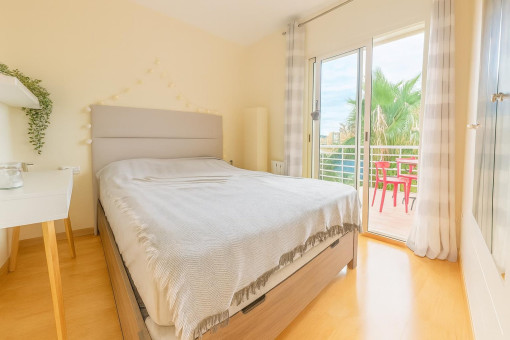 Bright bedroom with balcony access