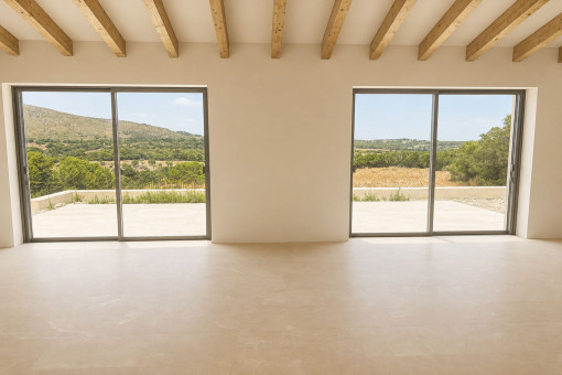 Living and dining area overlooking the countryside and pool