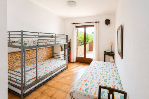 Additional bedroom with bunk bed and single bed
