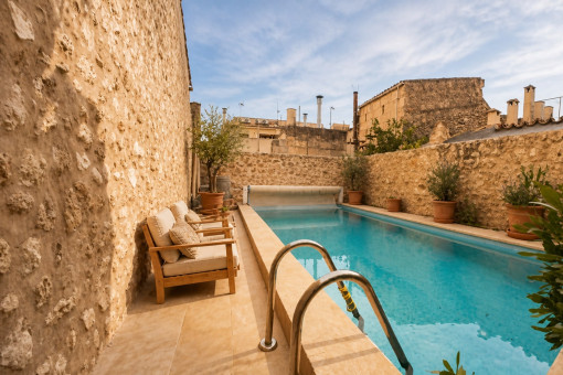 Private swimming pool with seating area