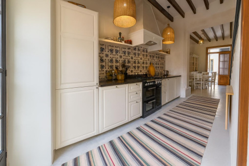 Long narrow kitchen with dining area