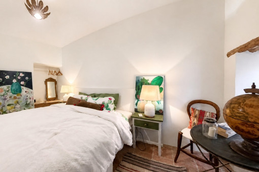 Cozy bedroom with art and lamps