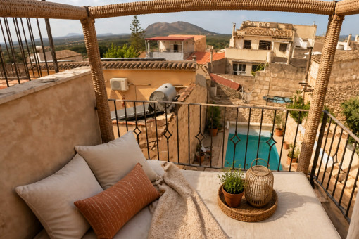 Cozy balcony overlooking private pool