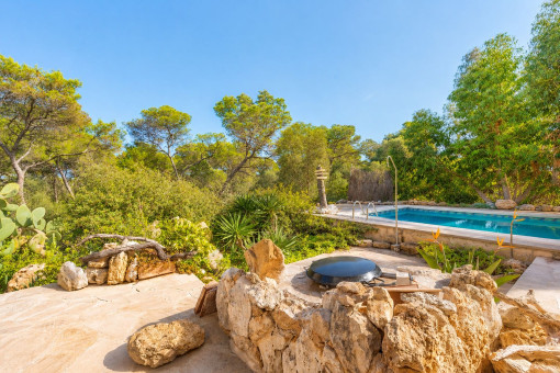 Pool and sun terrace surrounded by Mediterranean greenery