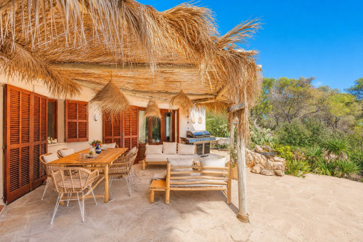 Idyllic covered terrace with outdoor dining area