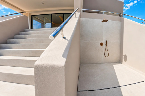 Outdoor staircase leading to the upper terrace