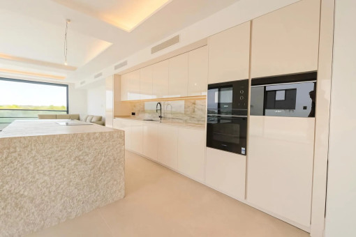 Modern designer kitchen with natural stone island