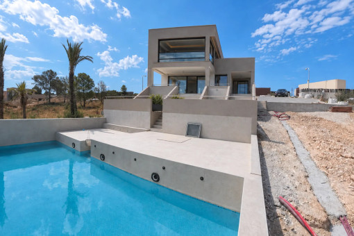 Private pool and modern villa façade in Son Gual