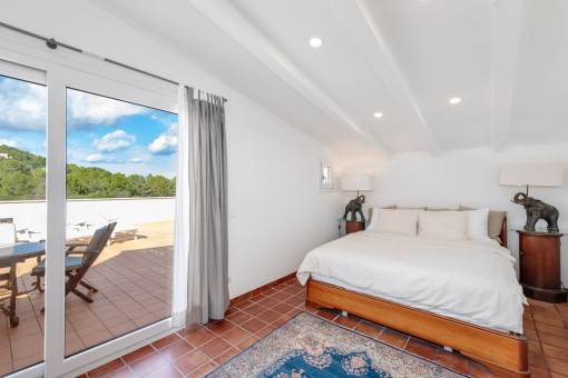 Bedroom on the upper level with a bright atmosphere