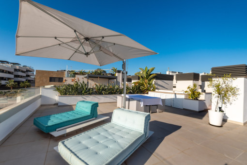 Spacious rooftop terrace with city views