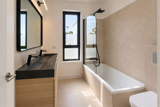Modern bathroom with bathtub and natural light