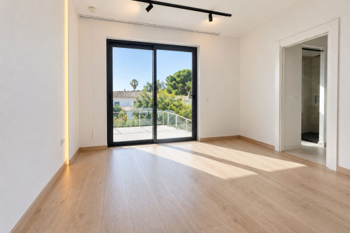 Bright bedroom with terrace access