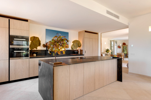 Black and Gold Marble Kitchen with wood accents