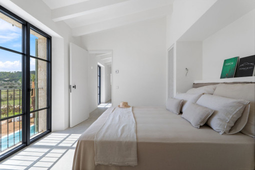 Bedroom with floor to ceiling windows