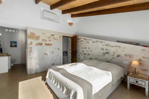 Master Bedroom on the Upper Floor with Natural Stone Features