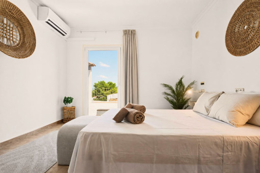 Second bedroom upstairs with balcony